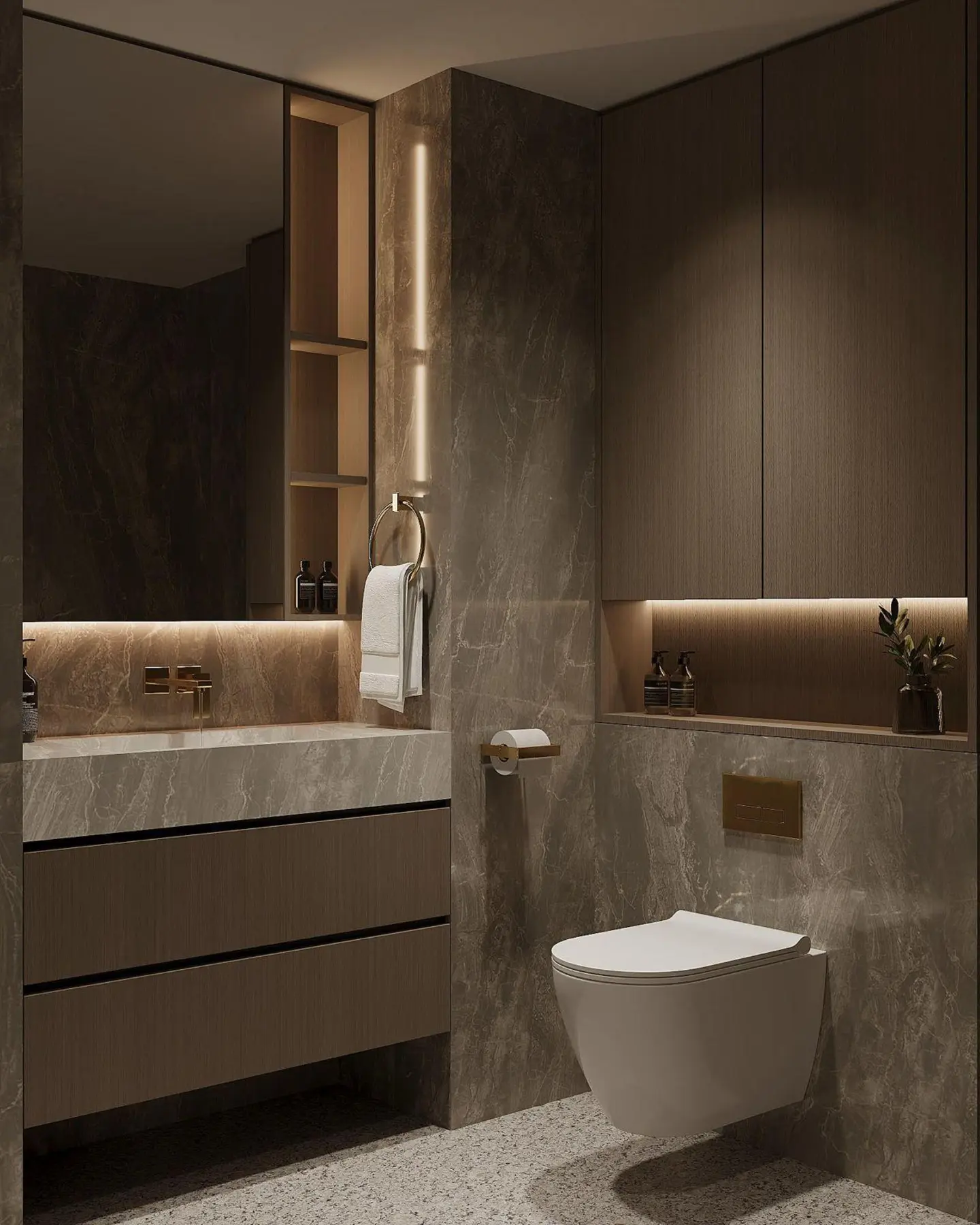 Master bathroom — grey stone vanity, gold fixtures, mirrored cabinet with warm cove lighting